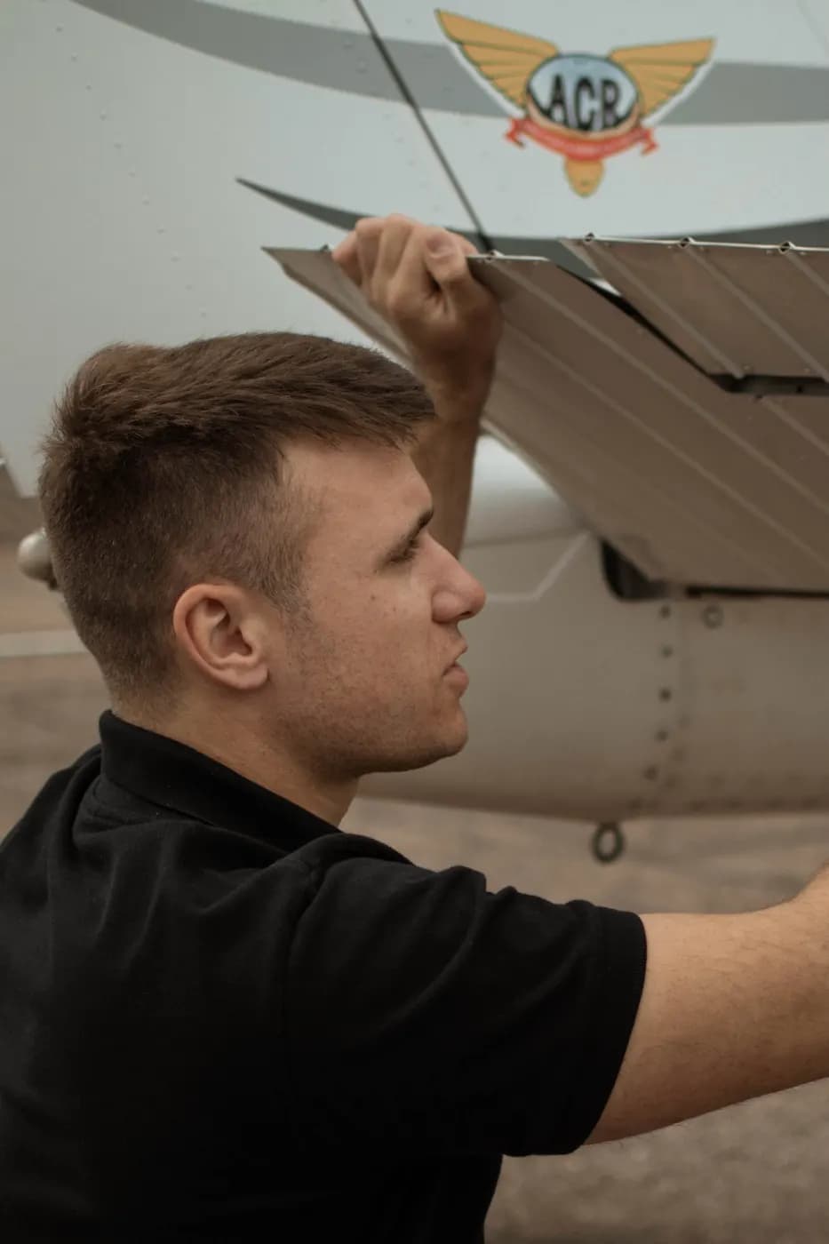 Checking the flap during the preflight inspection