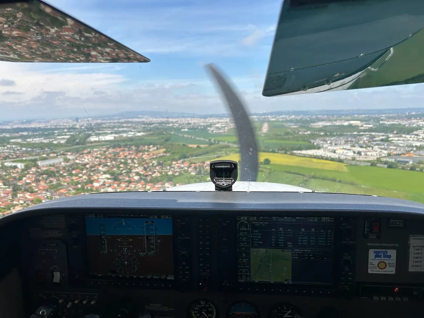 Cockpit view over a town