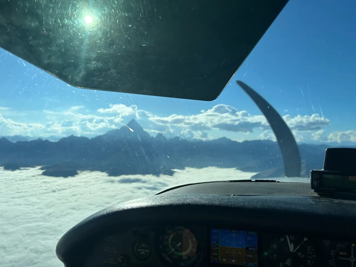 Above the clouds, mountains on the horizon