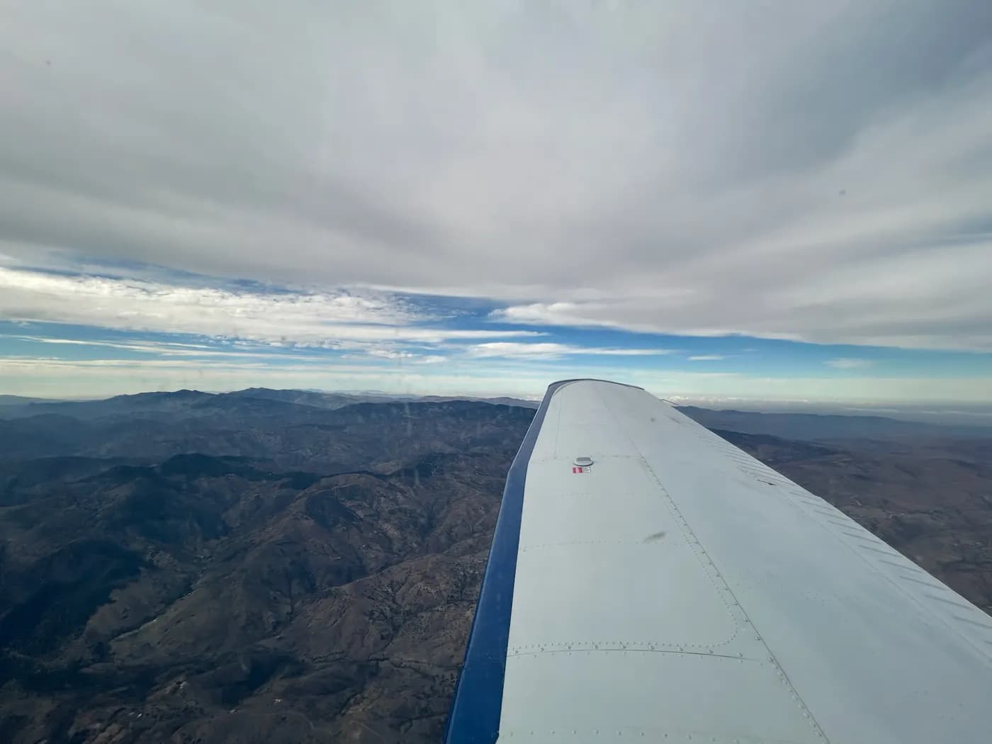 Wing over mountain ridges